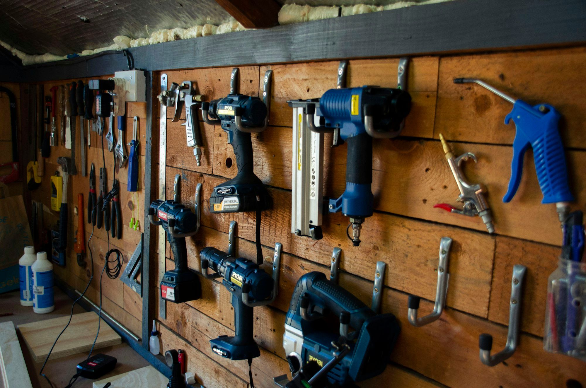 Hand tools hanging on the wall of a joinery workshop